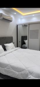 Postel nebo postele na pokoji v ubytování Jeeda Residence