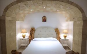 A bed or beds in a room at Tenute Al Bano