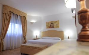 A bed or beds in a room at Tenute Al Bano
