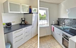 a kitchen with white cabinets and a counter top at Lovely Home In Klink With Kitchen in Klink