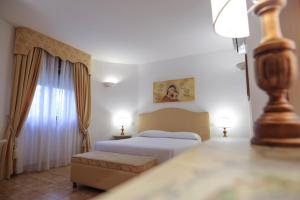 A bed or beds in a room at Tenute Al Bano