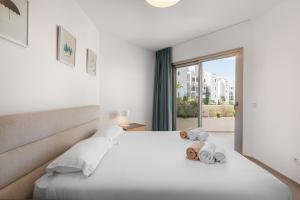 Katil atau katil-katil dalam bilik di Colinas - Tahona 3-2 PENTHOUSE JACUZZI & POOL VIEW +21 gambar
