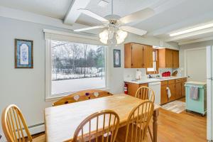 cocina con mesa de comedor y ventana en Waterfront Pine River Home with Shared Dock!, en Pine River