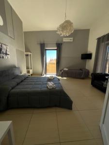 Postel nebo postele na pokoji v ubytování PERSEFONE LUXURY SUITE