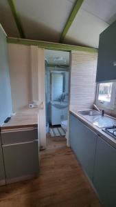A kitchen or kitchenette at Camping Dal Pino
