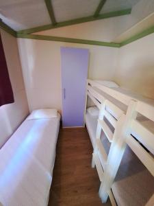 A bed or beds in a room at Camping Dal Pino