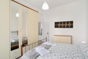 Ένα ή περισσότερα κρεβάτια σε δωμάτιο στο Casa paolino 50 metri dal mare