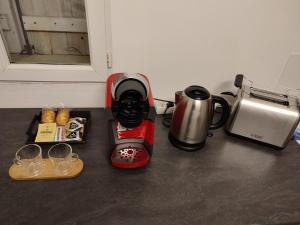 a coffee maker and a coffeemaker on a counter at Studio in Saint-Loubès