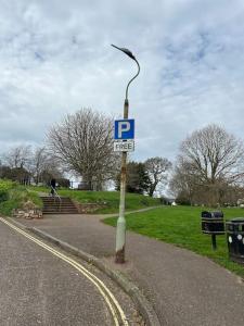 a street sign on the side of a road at Nomi Homes * Budleigh Salterton*Beach* Sleeps 4 in Budleigh Salterton