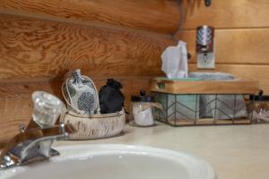 a bathroom sink with aaucet and a sink at Henry's Lake View Cabin + BBQ + Fire Pit + Decks! in Island Park +84 photos