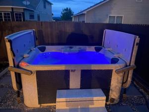 a large blue tub sitting in a yard at Lush 4BR, Large Bckyd, Hot Tub (Tal) in Helotes
