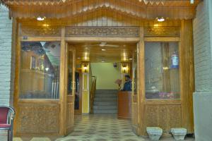 an entrance to a building with a person standing in the doorway at Hotel Town Centre in Srinagar