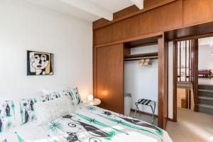 a bedroom with a large bed with aiger at Mid-Century Style And Class In Quiet NE Location in Cedar Rapids +37 photos