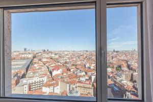 a view of a city from a window at Homeclub Exclusive Flat at Madrid Tower in Madrid