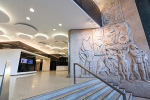 a stone relief on the wall of a building at Homeclub Exclusive Flat at Madrid Tower in Madrid