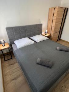 Posteľ alebo postele v izbe v ubytovaní Apartmány De Luxe