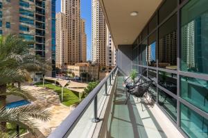 a balcony with hammocks and a view of a city at Frank Porter - Al Sahab 2 in Dubai