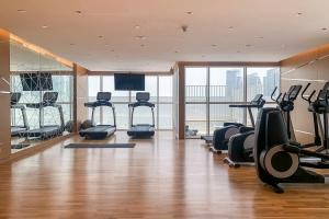 a gym with treadmills and exercise equipment in a building at Frank Porter - Carson A in Dubai Marina