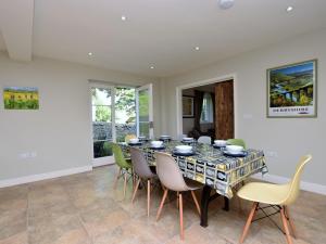 a dining room with a table and chairs at 4 Bed in Brassington 47450 in Brassington