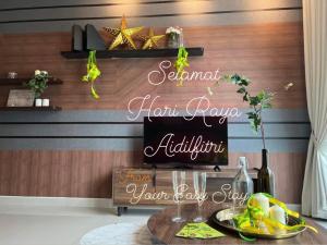 a dining room with a table with a sign that reads seventh ham royale at Luxurious Rustic Suite Conezion Botanical Garden IOI City Mall Putrajaya 5 plus 1 Paxs 3 Rooms 2 Baths in Putrajaya