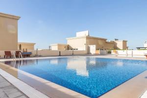 a swimming pool in the middle of a house at Frank Porter - Suburbia in Dubai