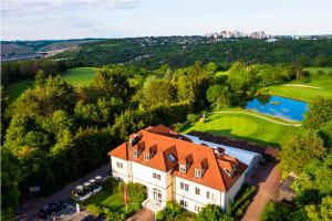 an aerial view of a house and a golf course at Best Western Hotel Würzburg-Süd in Würzburg