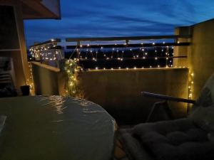 a room with a table and lights on a balcony at Apartment KY481 im PanoramicHohegeiß in Braunlage
