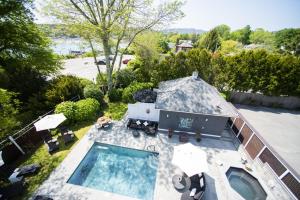an aerial view of a house with a swimming pool at Lindenwood Inn in Southwest Harbor