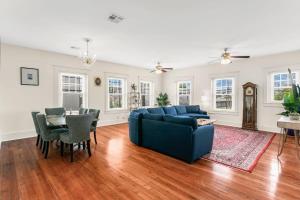 a living room with a blue couch and a table at Stunning 2BD luxury apt perfect NOLA location in New Orleans