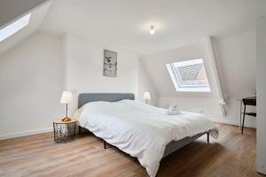 A bed or beds in a room at Maison L'Escale Paisible