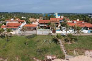 an aerial view of a house on the beach at Breeze & Shade Beira Mar in Parnamirim