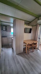A kitchen or kitchenette at Camping Dal Pino