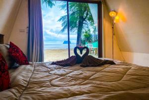 Postel nebo postele na pokoji v ubytování Modtanoi Paradise Homestay