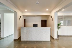 an office lobby with a white reception desk at Casa Eternal Resort Mandrem in Mandrem