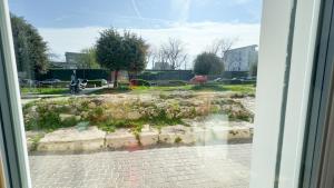 a view of a street from a window at Onda Blu House by Ca-Sa Check in Chioggia