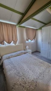 A bed or beds in a room at Camping Dal Pino