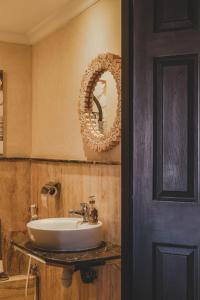 a bathroom with a sink and a mirror at Magnifiaue appart in Marrakesh