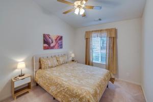 a bedroom with a bed and a ceiling fan at Page Home with Waterfall about 2 Mi to Lake Powell! in Page