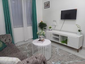 TV a/nebo společenská místnost v ubytování Havy Homes