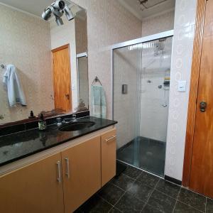 a bathroom with a shower and a sink and a showerspective at Hostel On Top1 CGH SP Congonhas São Paulo in Sao Paulo