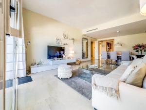 a living room with a couch and a table at 111 - Penthouse Apartment, La Cala in Mijas