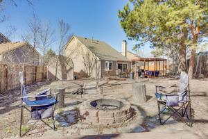 a yard with two chairs and a fire pit at Pet-Friendly Colorado Springs Home with Mtn Views! in Colorado Springs