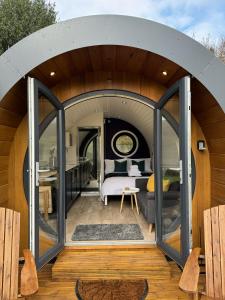 een kamer met een bed en een groot raam bij Luxury Glamping In North Yorkshire National Park & Coastal Area in Scarborough