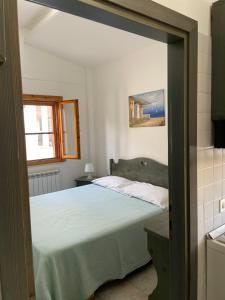 Letto o letti in una camera di B&B Dalla Nonna