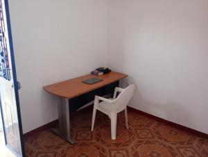 a small desk with a chair and a laptop on it at Luna y Mar in Oaxaca City