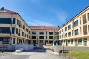 a large apartment building with a lot of windows at O Pindo in O Pindo