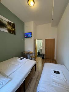 Ein Bett oder Betten in einem Zimmer der Unterkunft Stadtoase im Herzen Berlins