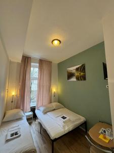 Ein Bett oder Betten in einem Zimmer der Unterkunft Stadtoase im Herzen Berlins