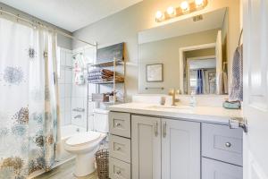 a bathroom with a sink and a toilet and a shower at Private and Picturesque Escape on Lake Henry! in Lake Placid +23 photos