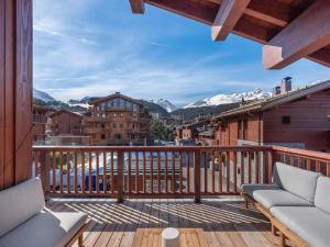 a balcony with a view of the mountains at Chalet Courchevel 1650, 6 pièces, 12 personnes - FR-1-563-141 in Courchevel
